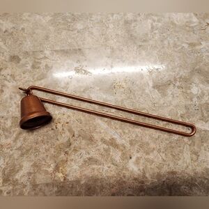 Rustic, aged, distressed bronze colored, metal candle snuffer or home decor item